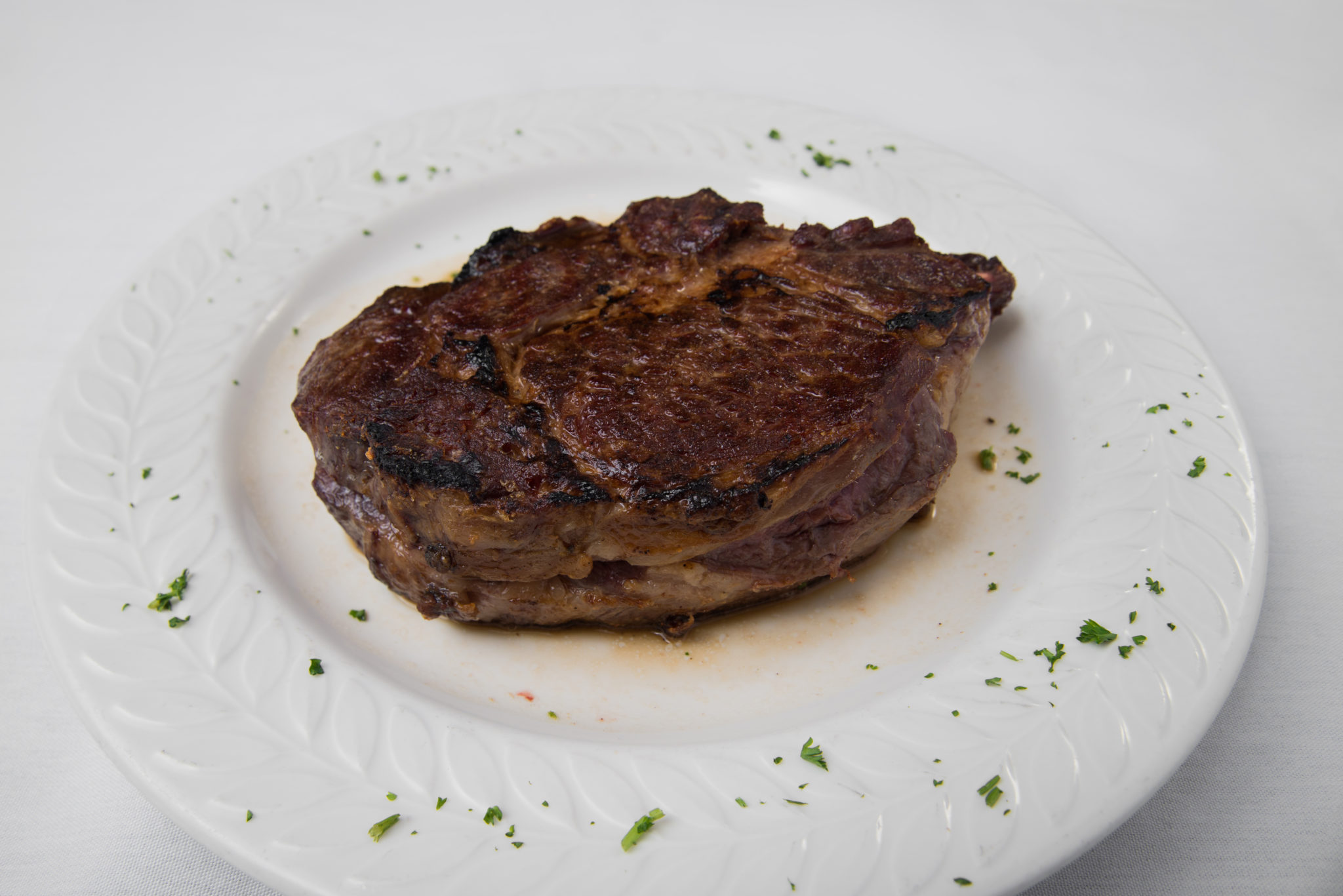 Jim’s Steakhouse signature dishes Filet Mignon, French Onion Soup, Steak de Burgo, Twice Baked Potato